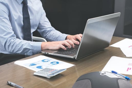 office-staff-typing-on-laptop (1)